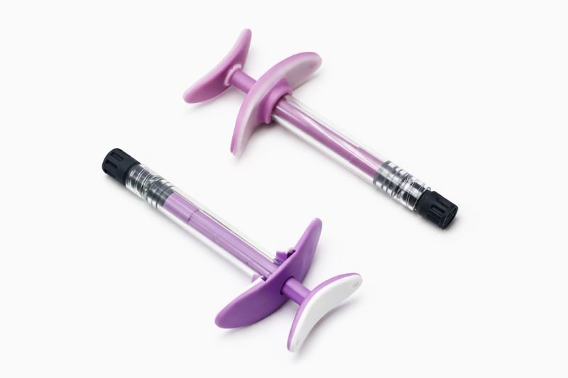 Polymer prefillable syringes