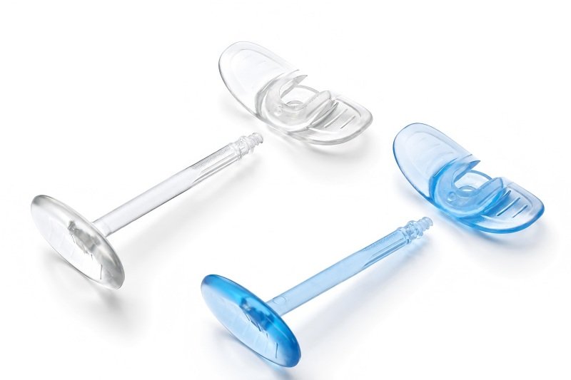 Heat resistant plunger rods and backstops for prefillable syringes
